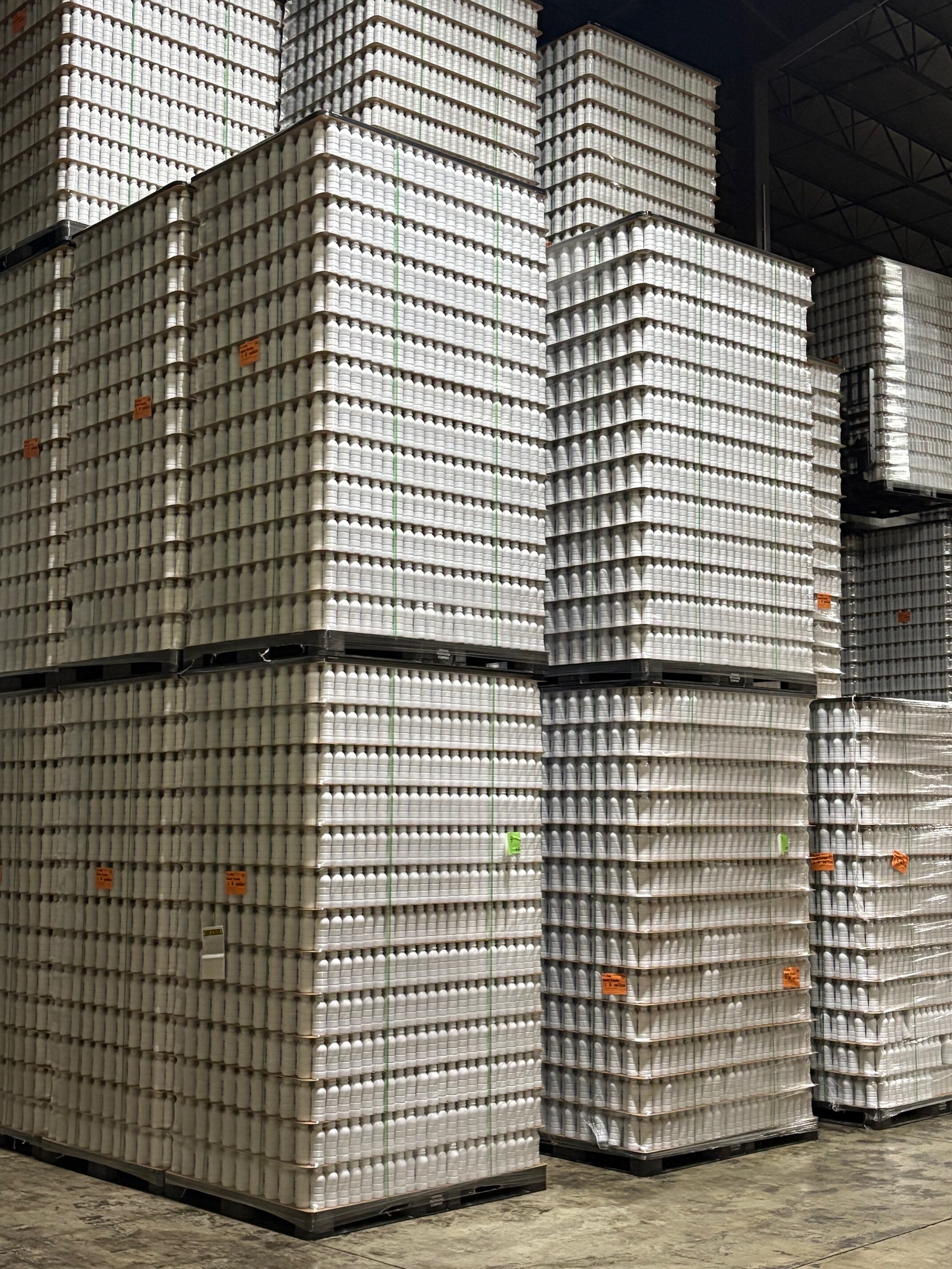 Pallets of bottles in warehouse
