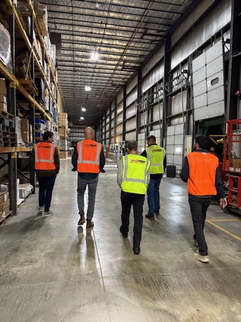 people touring a Milwaukee warehouse