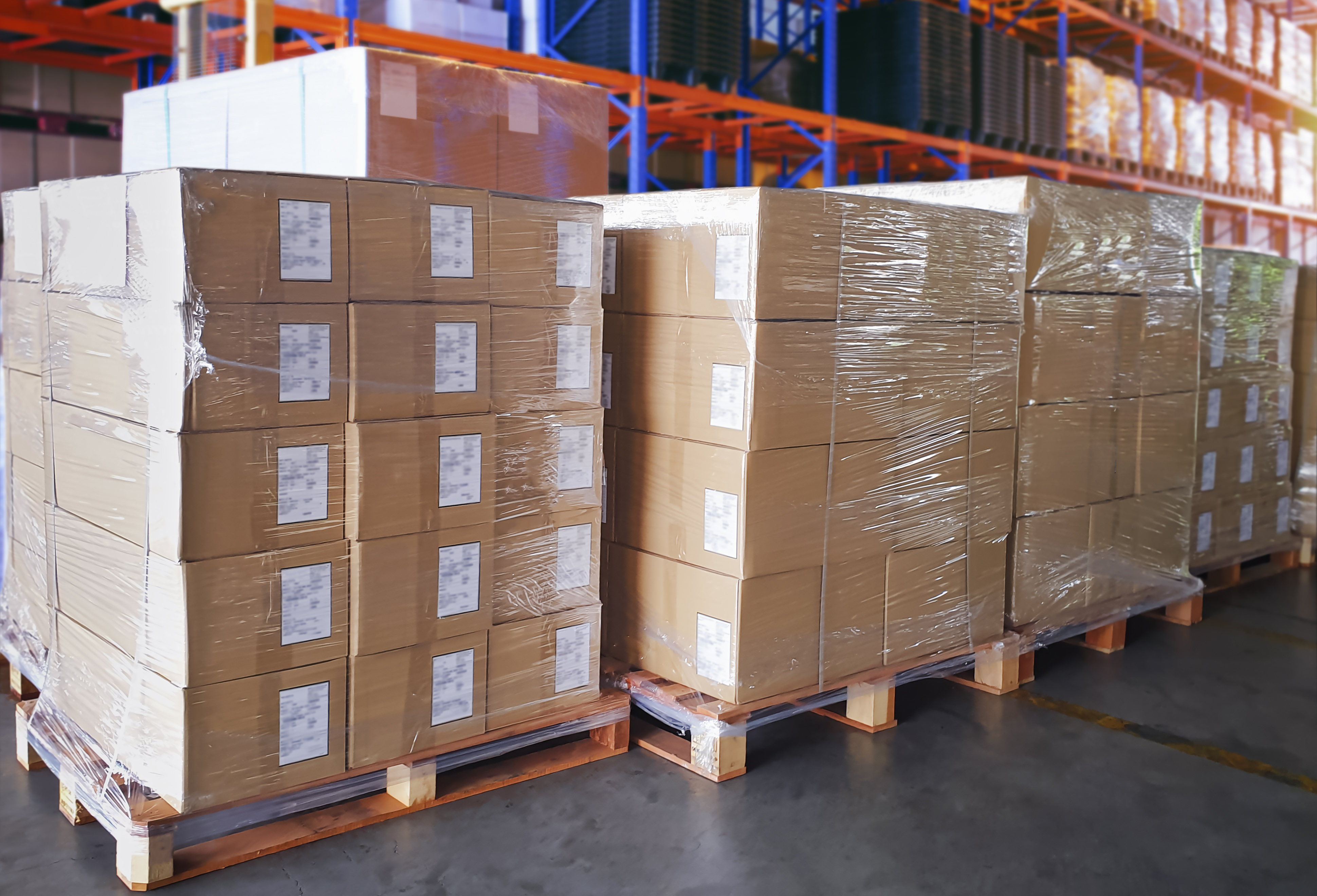 boxes stacked on pallets in warehouse