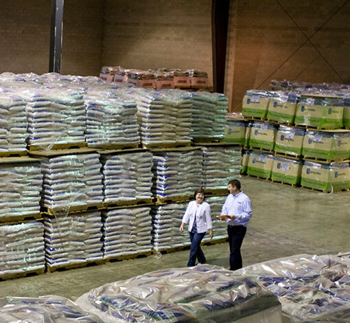 people walking through large warehouse