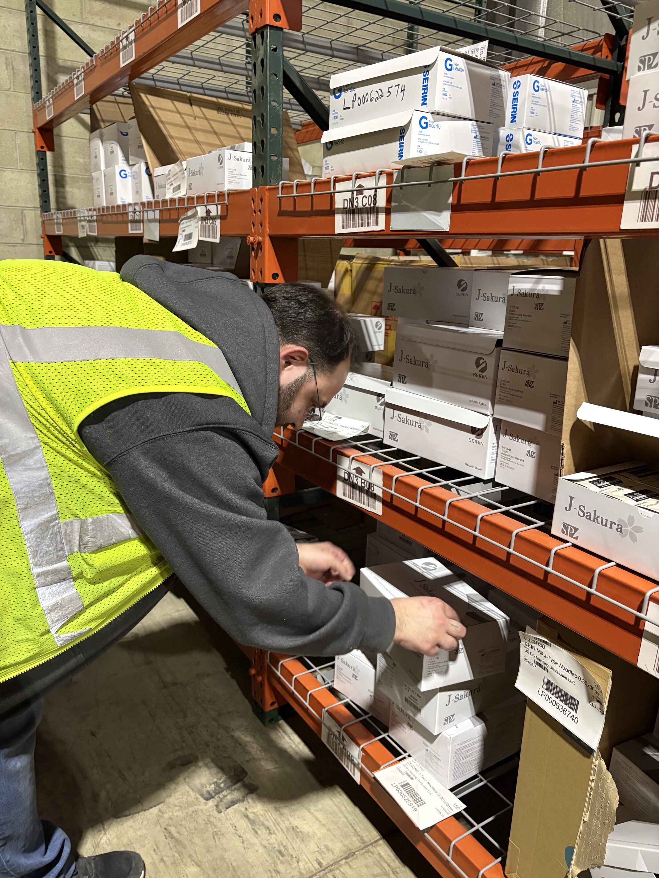 man fulfilling orders in warehosue